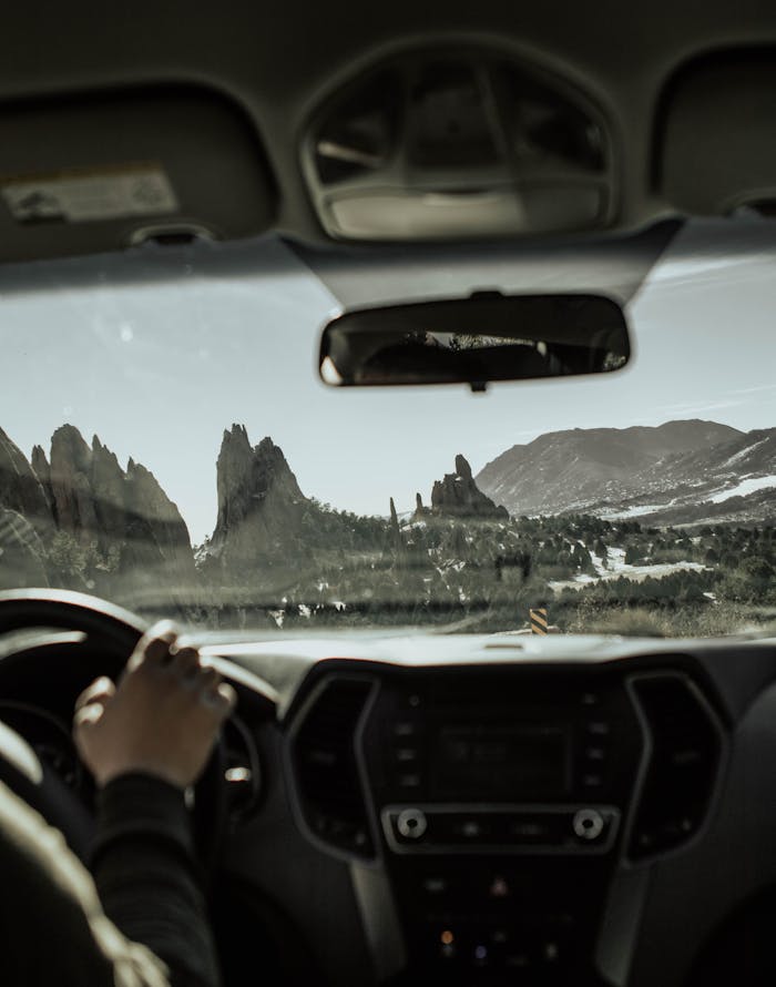Enjoying a scenic drive through Garden of the Gods with stunning red rock formations.